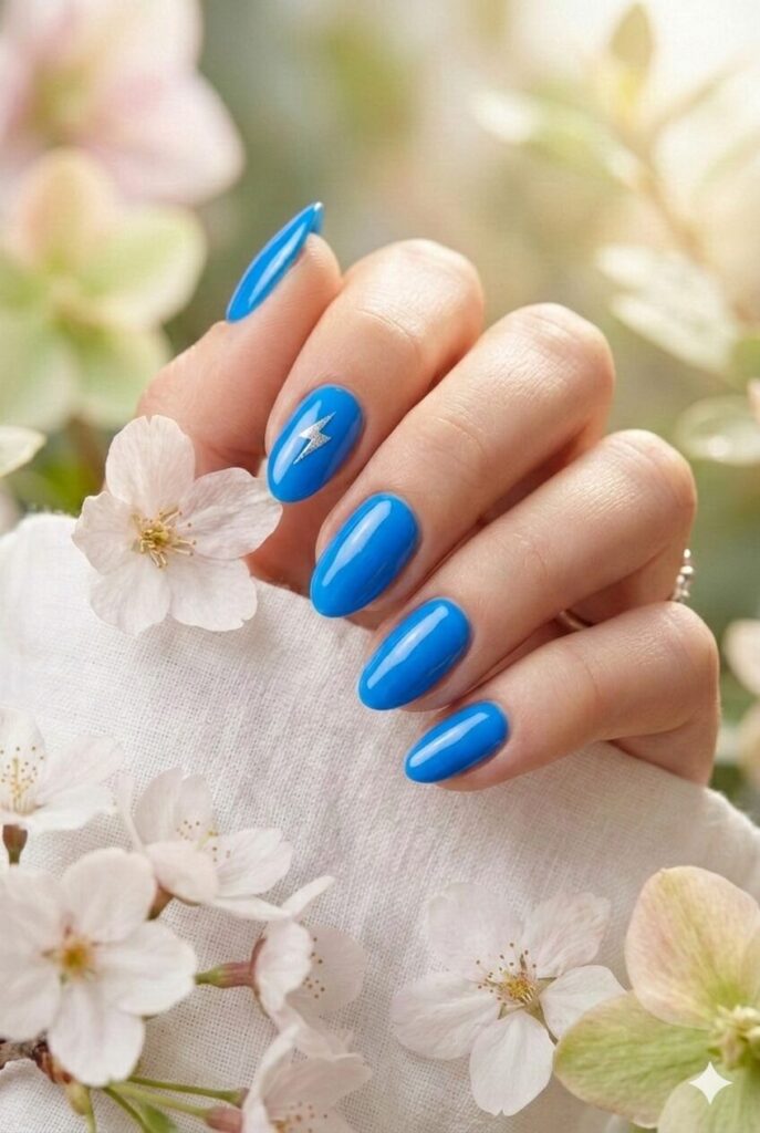 Electric blue spring nails with bright vibrant intense shade, bold confident statement manicure for spring 2026