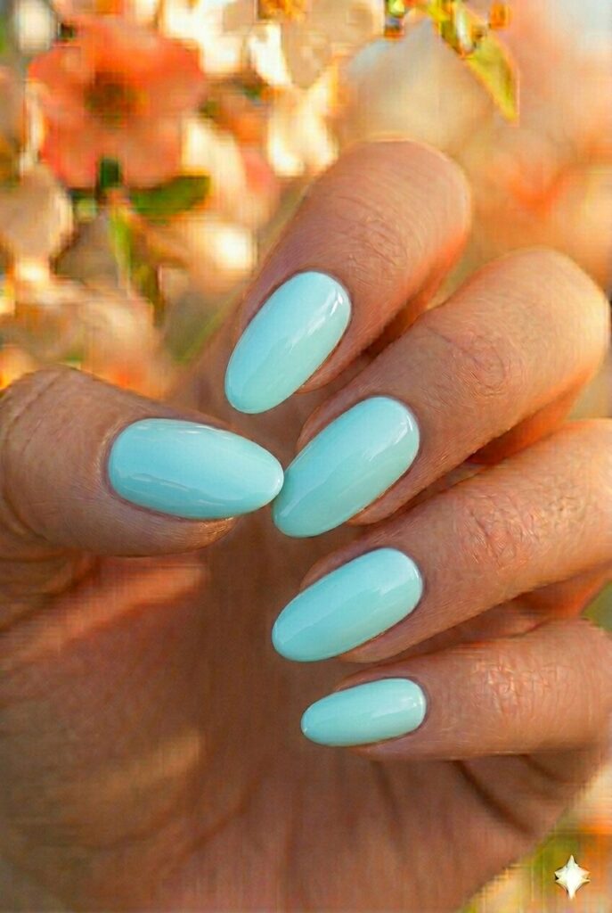  Light aqua spring nails with fresh blue-green ocean inspired shade on almond nails, tropical beach manicure for spring 2026