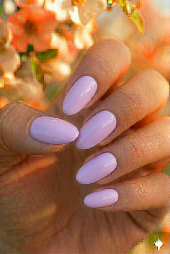 Soft lilac spring nails with pretty light purple shade on oval shaped nails, feminine trendy manicure for spring 2026