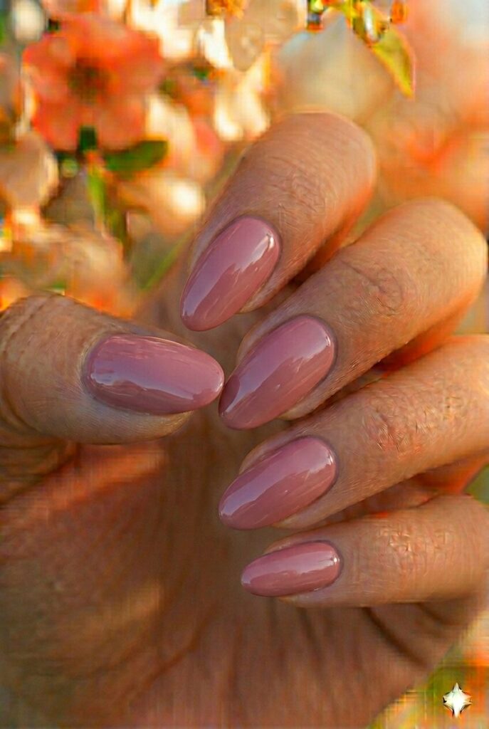 Dusty rose spring nails with muted sophisticated pink shade on almond nails, romantic elegant manicure for spring 2026