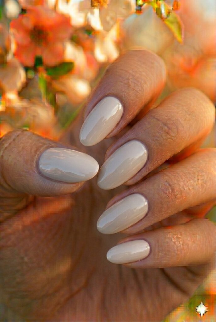 Light gray spring nails with soft warm gray modern shade on almond nails, chic minimalist manicure for spring 2026