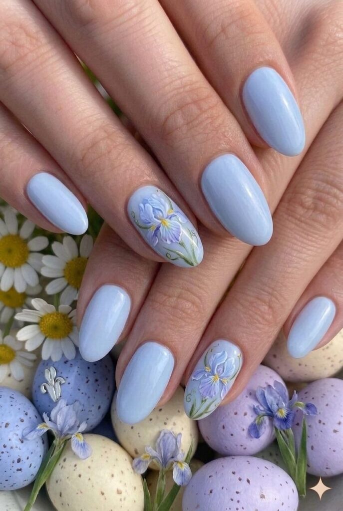 Pale iris blue pastel Easter nails with soft blue slight purple hints like iris flowers, elegant botanical manicure 2026