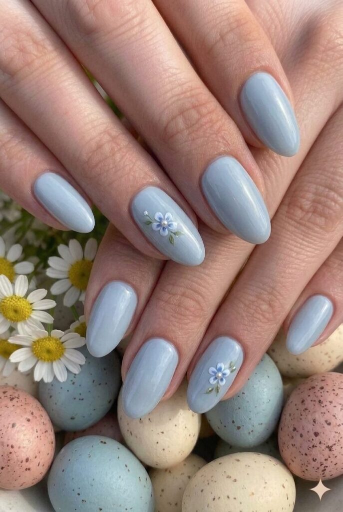Pale dusty blue pastel Easter nails with soft blue gray undertones vintage look, timeless refined manicure 2026