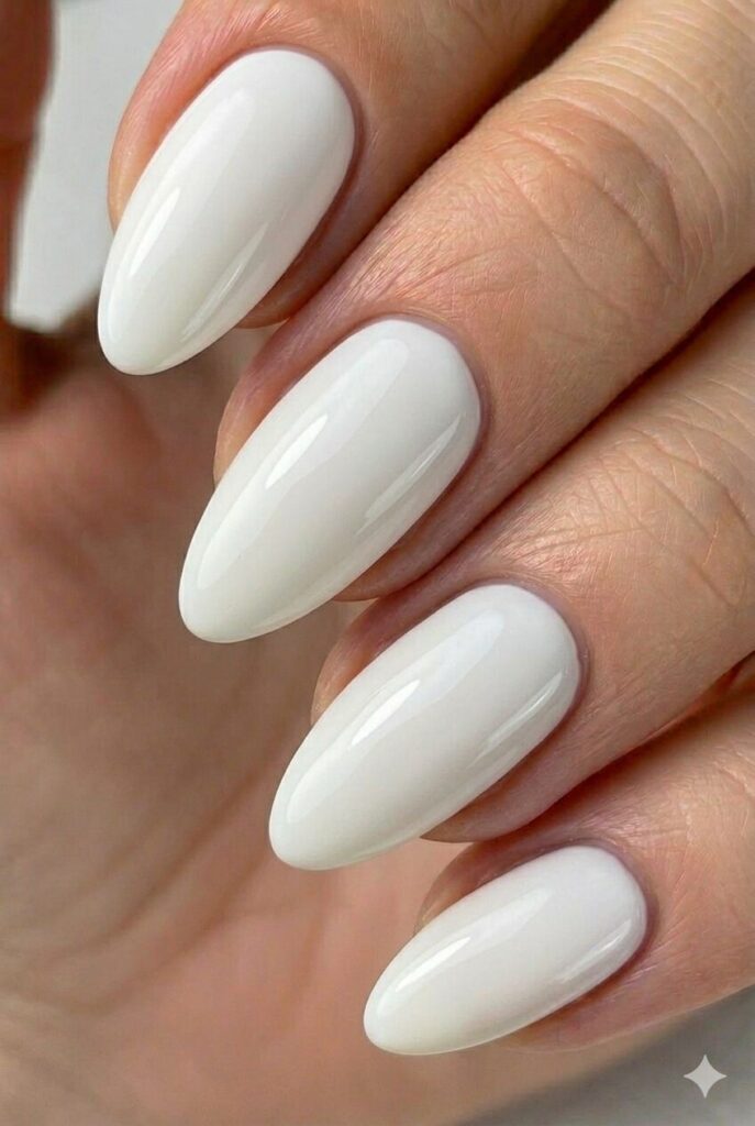 Coconut white tropical summer nail design with crisp clean white shade like coconut and beach sand, minimal summer nail idea 2026