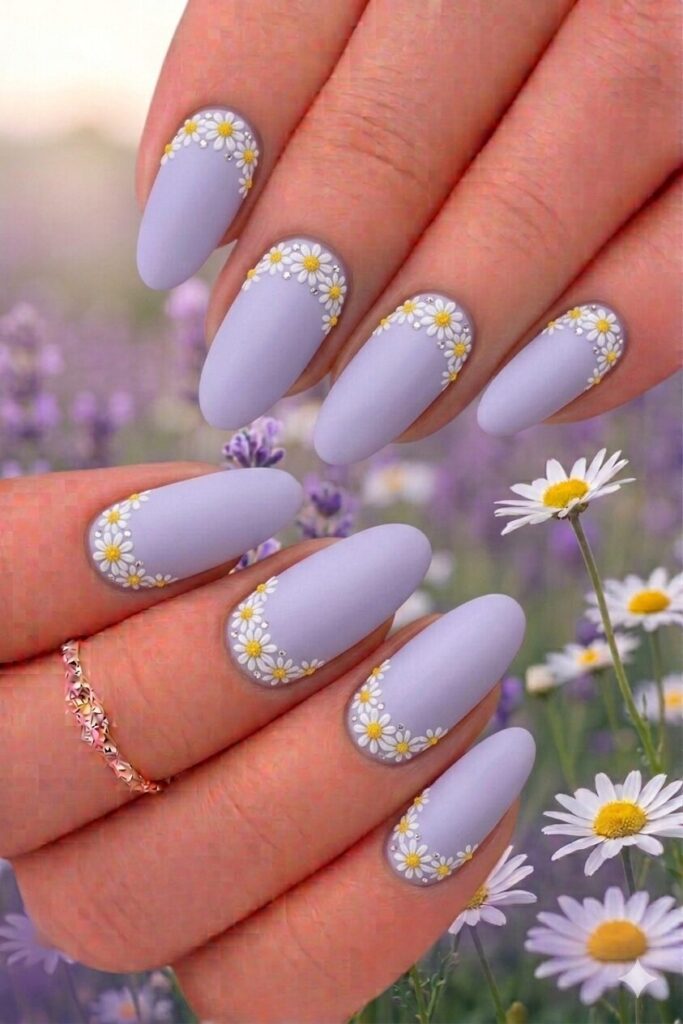 Daisy crown border nail art with daisies arranged in crown arc shape at base framing cuticle, regal beautiful manicure 2026