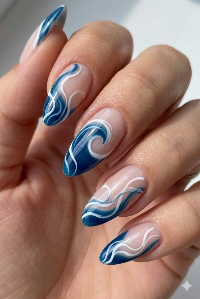 Wave swirl blue white summer nail design with flowing swirl patterns in ocean colors like currents, artistic summer nail idea 2026