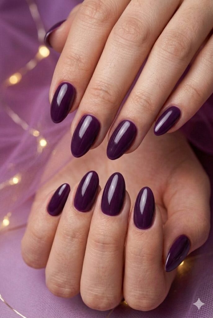Blackberry shine almond purple prom nails with a rich deep purple glossy finish