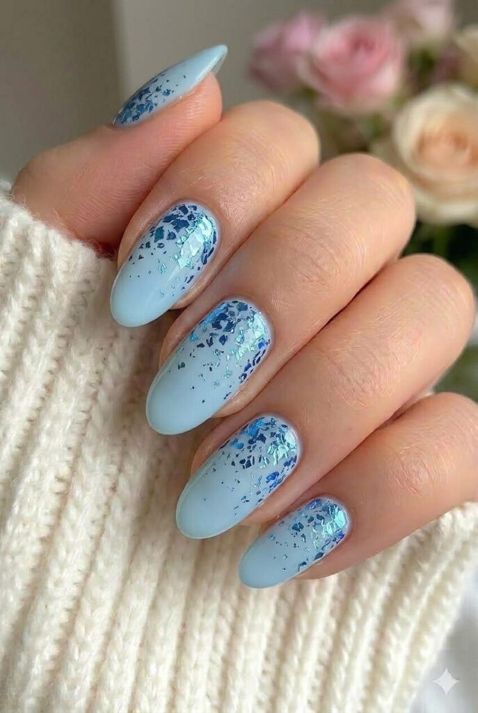 Blue foil fade prom nails with soft blue base and metallic foil fade accents