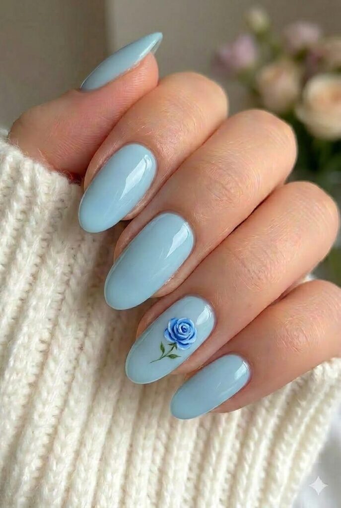 Blue rose accent prom nails with simple base and tiny blue rose floral detail