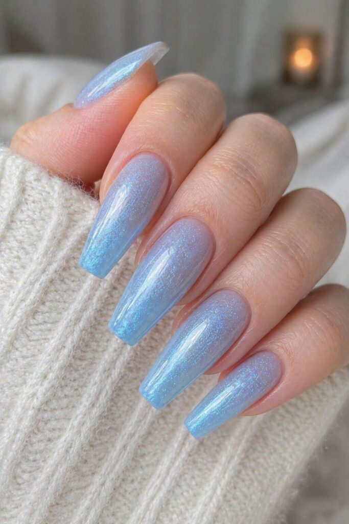 Blue shimmer coffin prom nails with pale blue shimmer on long coffin nails