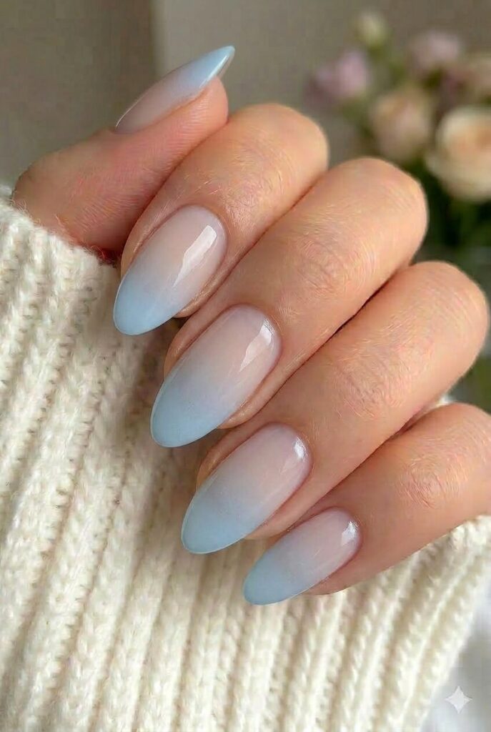 Blue tulle fade prom nails with powder blue fading into sheer base for a soft finish
