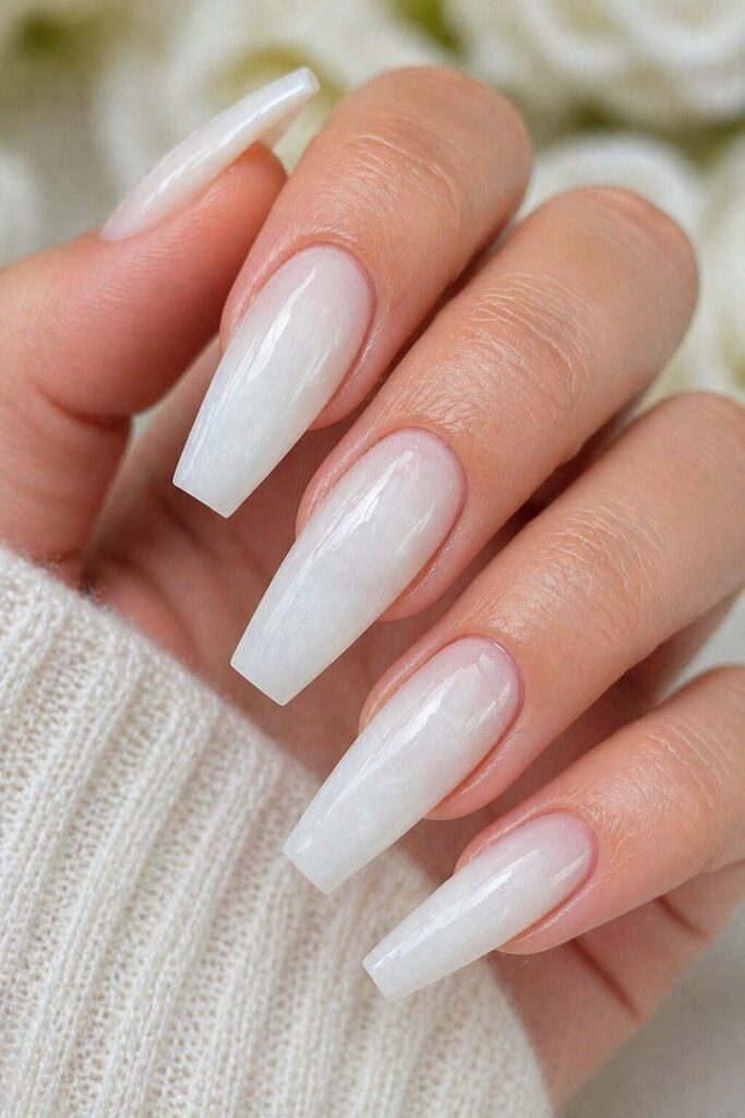 Cloud white coffin prom nails with a soft airy finish for a bold and polished evening look
