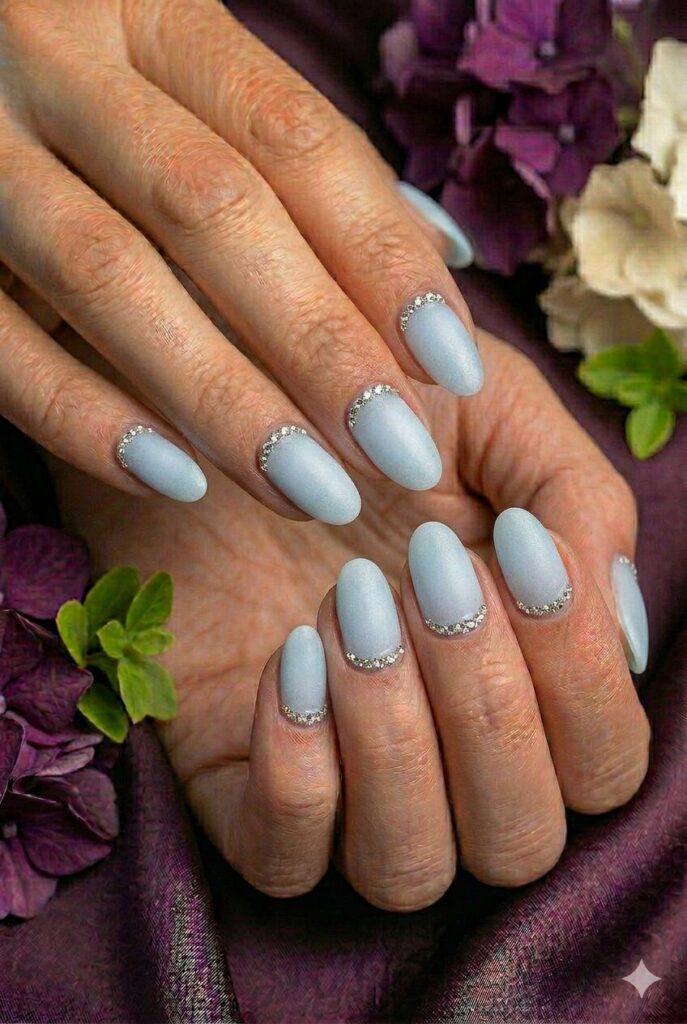 Frosted ice blue prom nails with a cool soft finish for a fairy-tale evening look