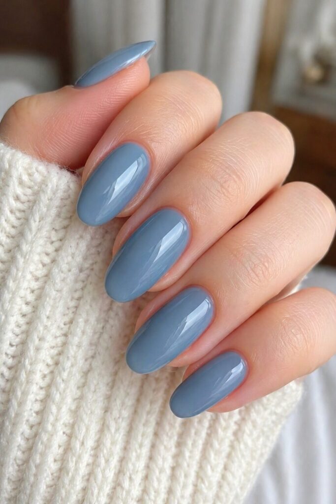 Icy denim gloss blue prom nails with muted denim blue shade and high gloss finish