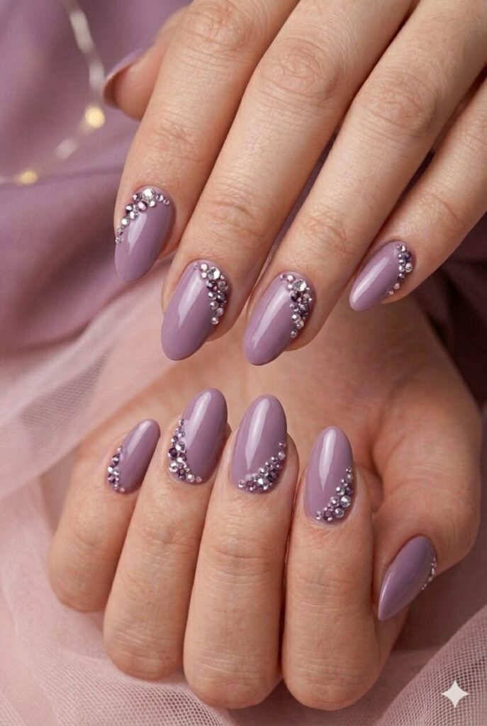 Mauve crystal cluster purple prom nails with dusty mauve base and tiny crystal groups