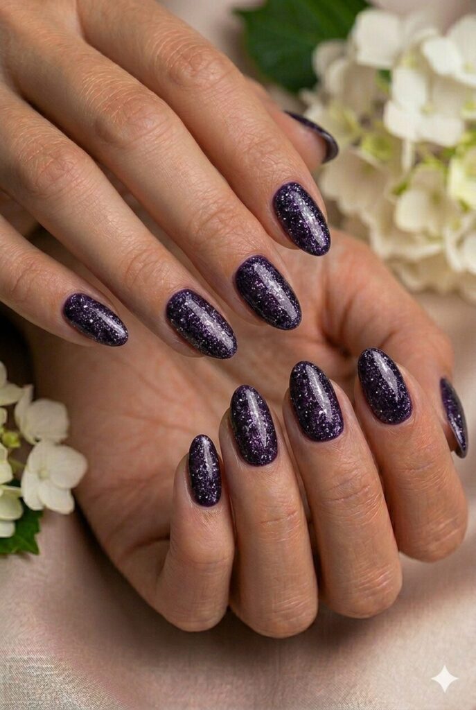 Midnight purple glitter prom nails with smoky sparkle for a dramatic and glamorous finish