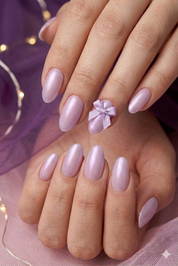 Orchid pearl mist purple prom nails with a pale purple base and soft pearly glow