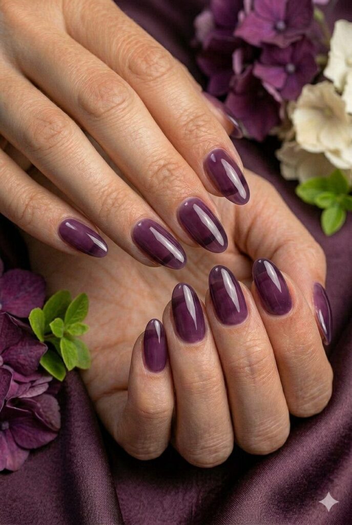 Plum jelly glass prom nails with a glossy see-through purple finish for a modern evening look