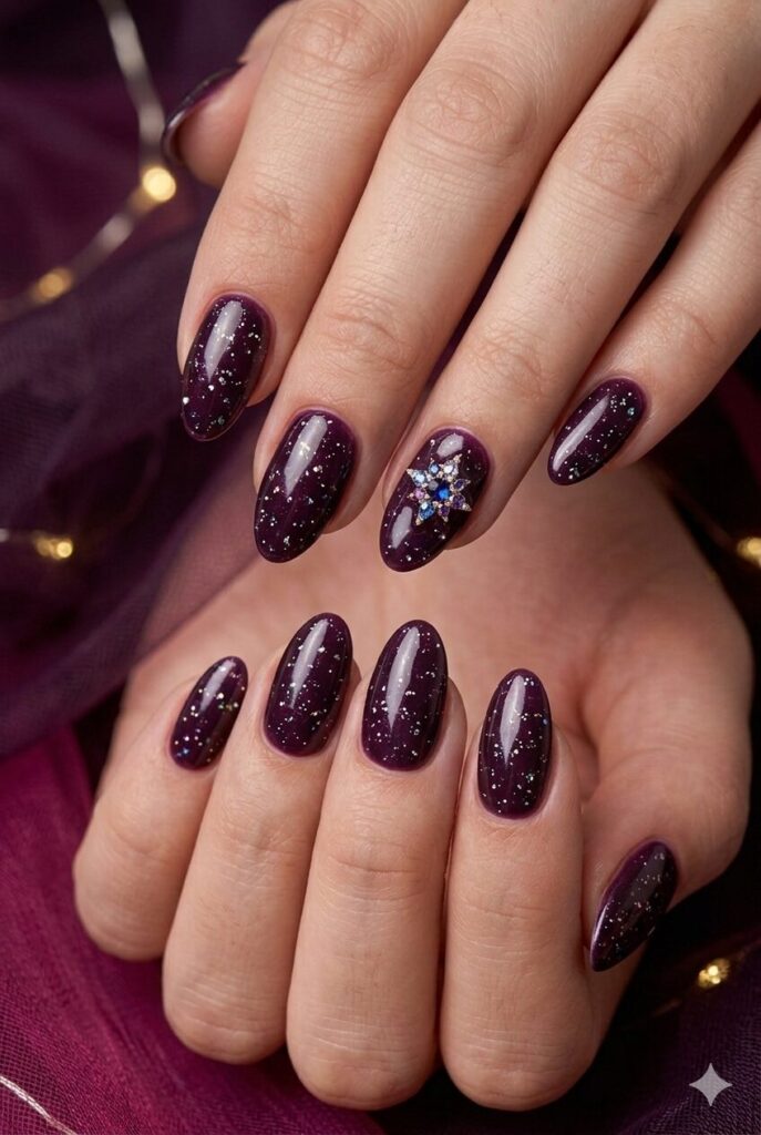 Plum stardrop purple prom nails with a deep plum base and tiny sparkle drops