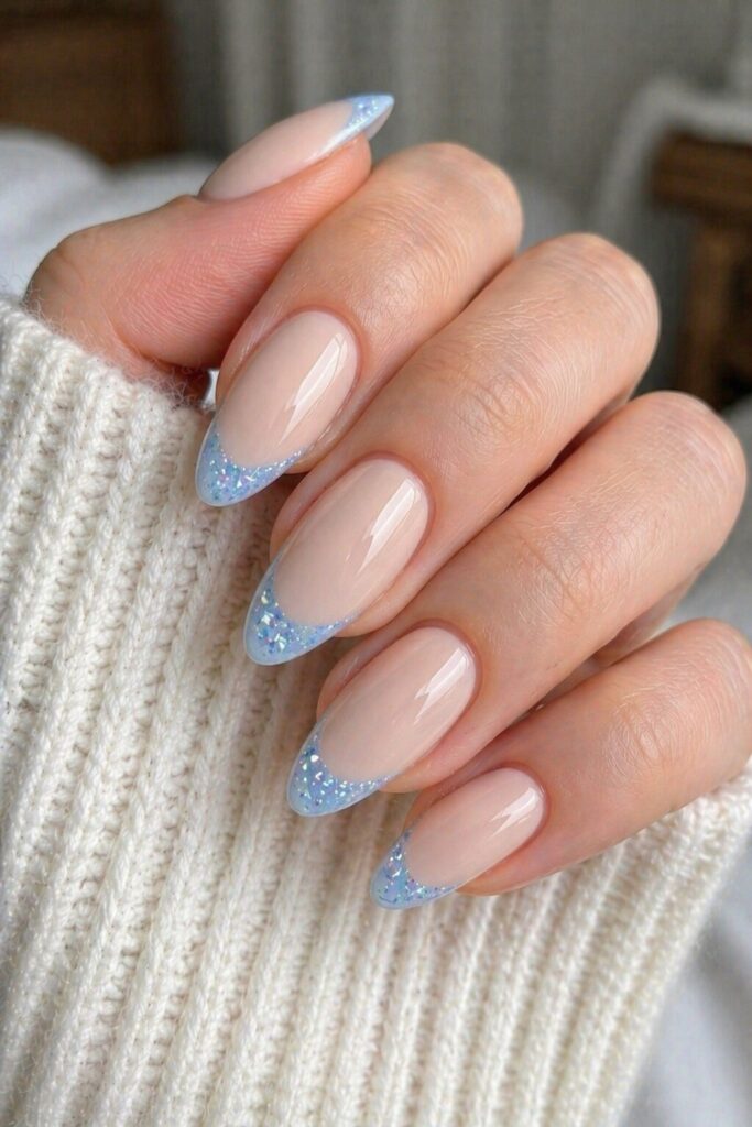 Sky blue diamond tip prom nails with natural base and pale blue glitter tips
