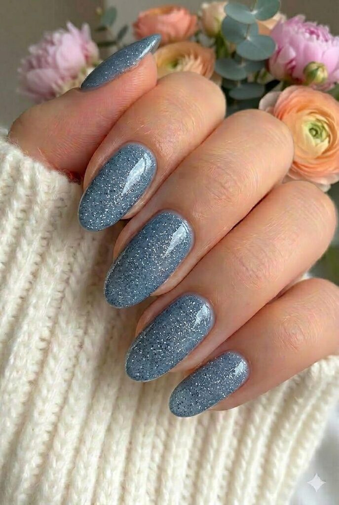 Slate blue sparkle prom nails with muted slate blue shade and fine shimmer finish