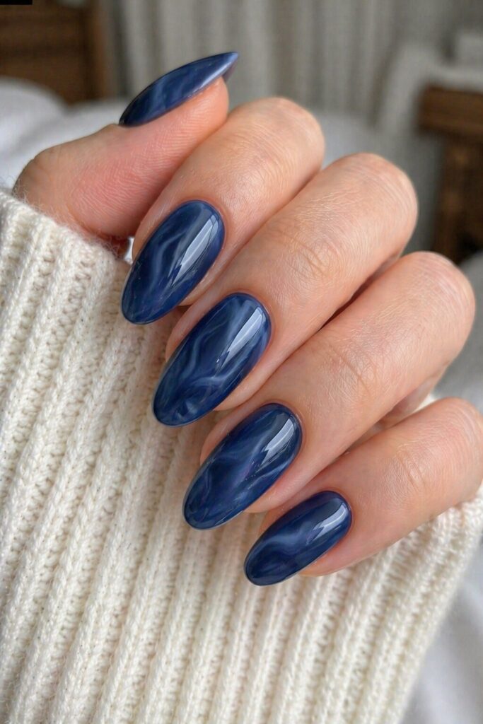 Smoky navy quartz blue prom nails with deep blue and soft smoky swirls