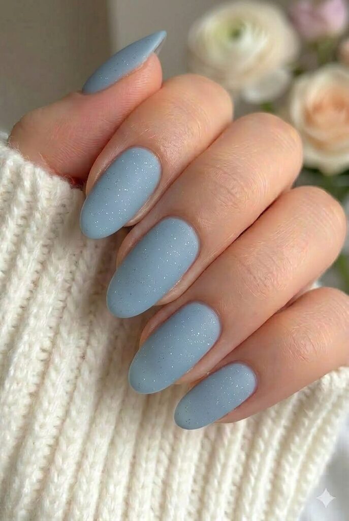 Steel blue matte spark prom nails with cool steel blue base and scattered sparkle