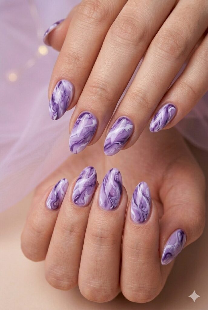 Violet marble glow purple prom nails with violet and white marble swirls and glossy finish