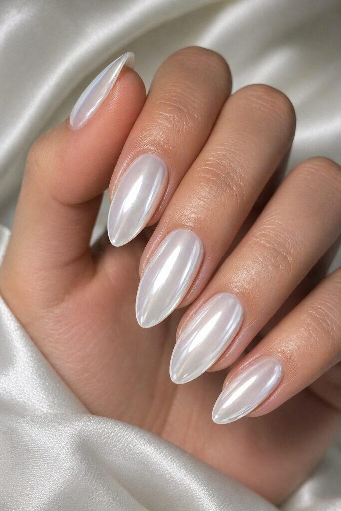 White chrome prom nails with a bright reflective finish for a trendy 2026 prom manicure