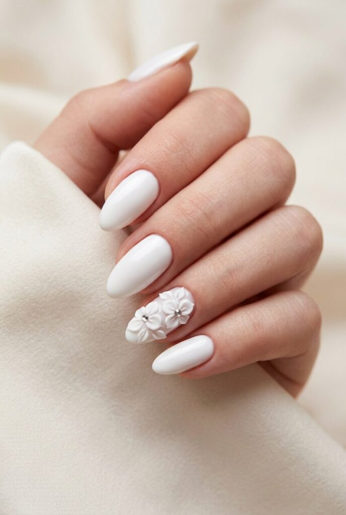White floral 3D prom nails with tiny raised flower accents for a romantic statement manicure