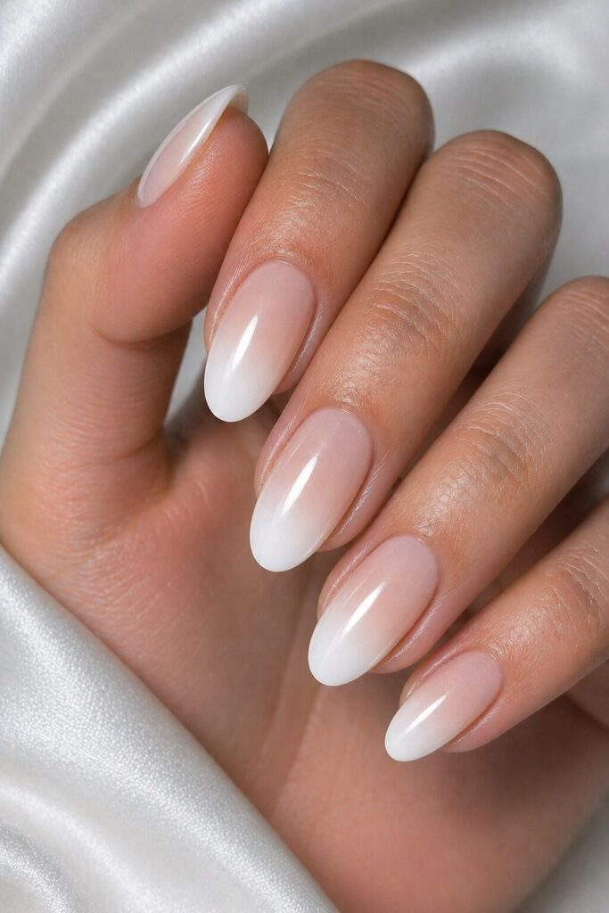 White French fade prom nails with a soft nude blend for a timeless and elegant manicure