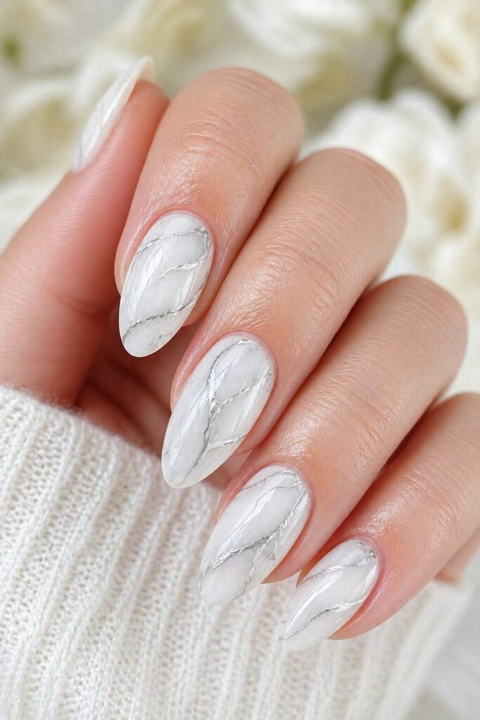 White marble vein prom nails with soft gray details for a luxury and artistic formal manicure