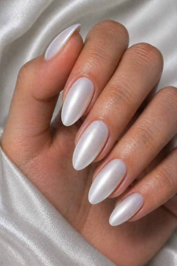 White satin finish prom nails with a silky soft look for a modern elegant manicure