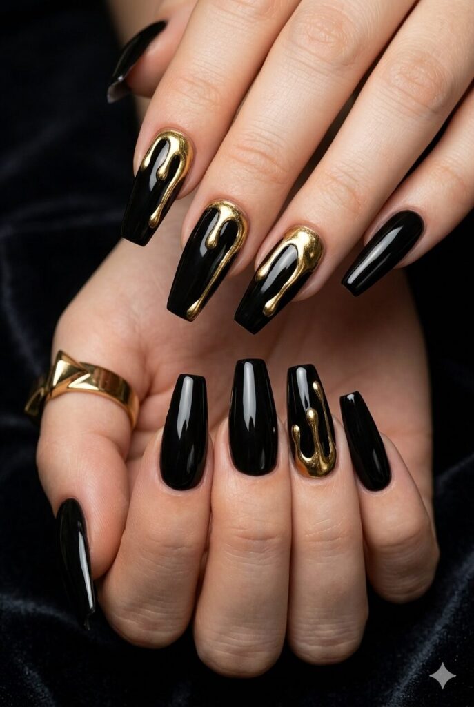 Long coffin nails with glossy black base and gold drip details
