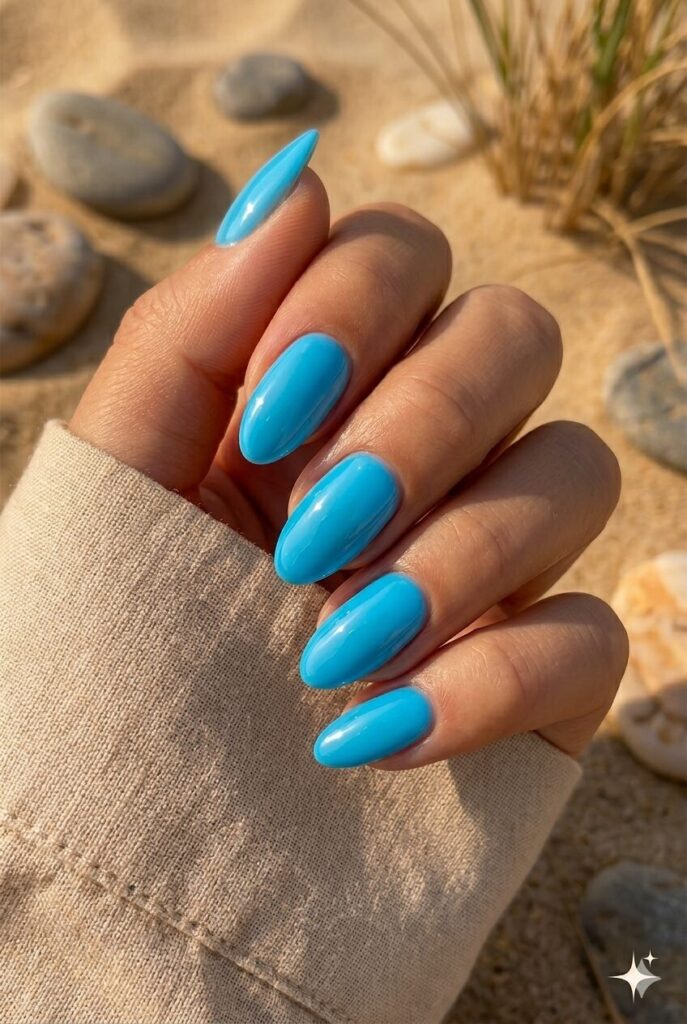 Short almond nails with bright pool blue glazed glossy finish