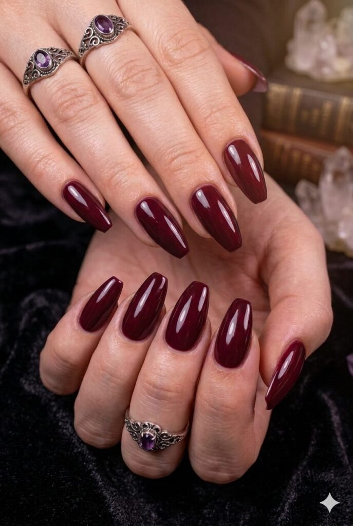 Almond coffin nails with rich deep wine glossy polish