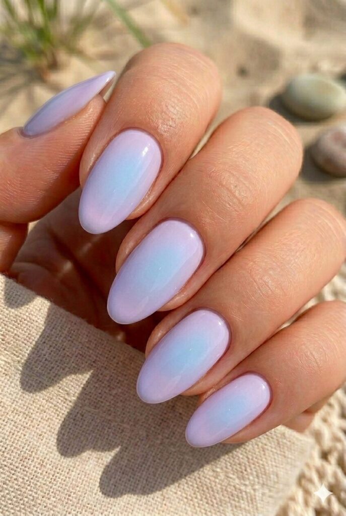 Soft lavender almond nails with faint blue aura glow