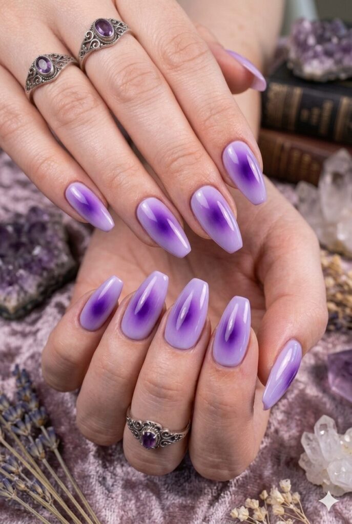 Almond nails with soft lavender and deep purple aura glow center