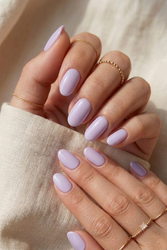 Short oval nails with soft lavender glossy summer polish