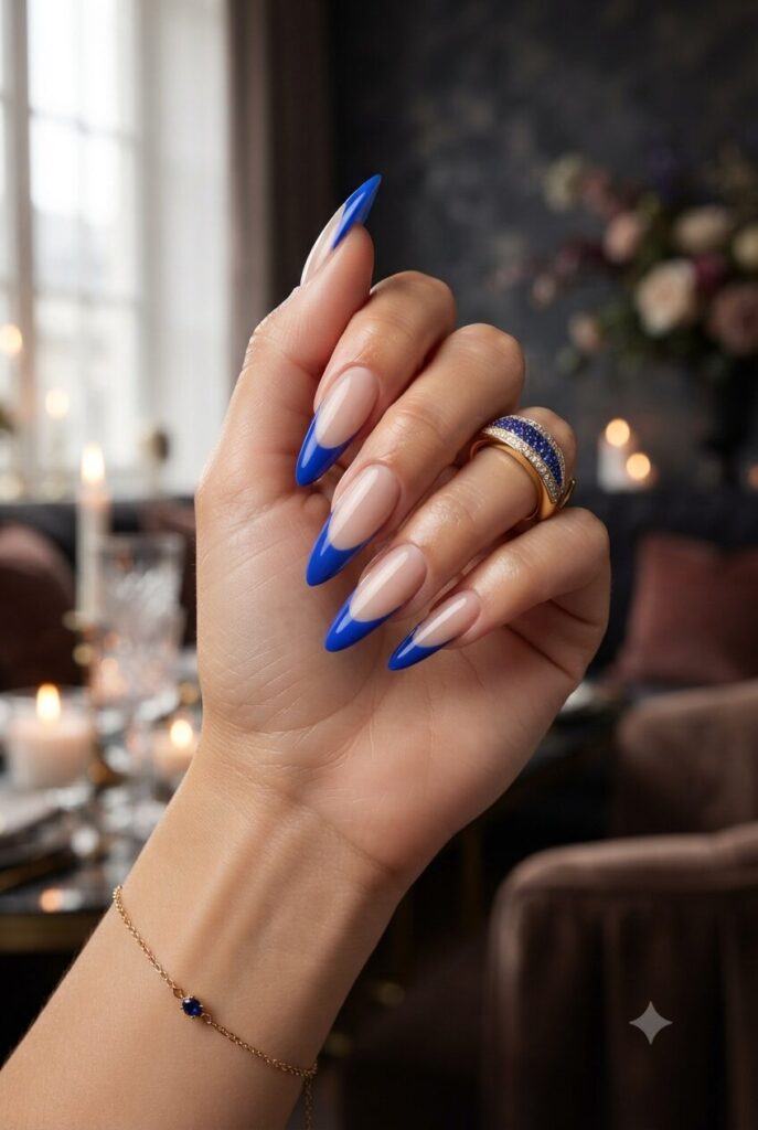 Long stiletto nails with bold cobalt blue French tips