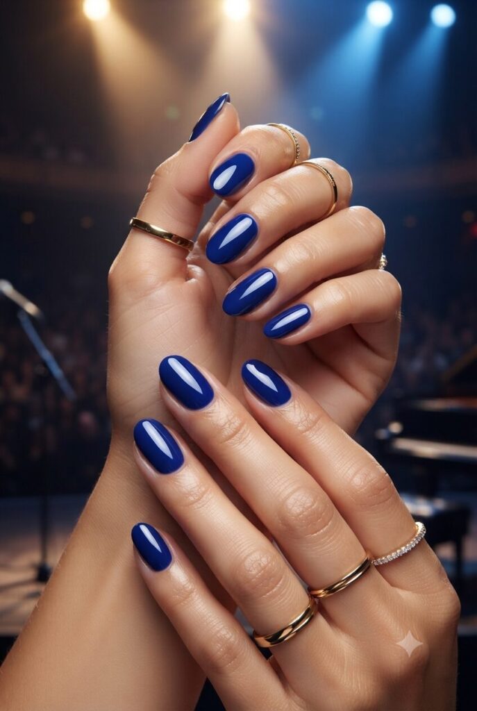 Short almond nails with glossy bold cobalt blue polish