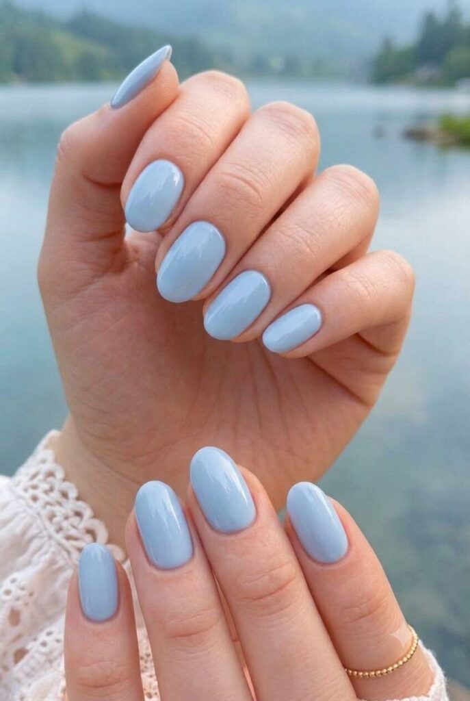 Short oval nails with glossy soft powder blue polish