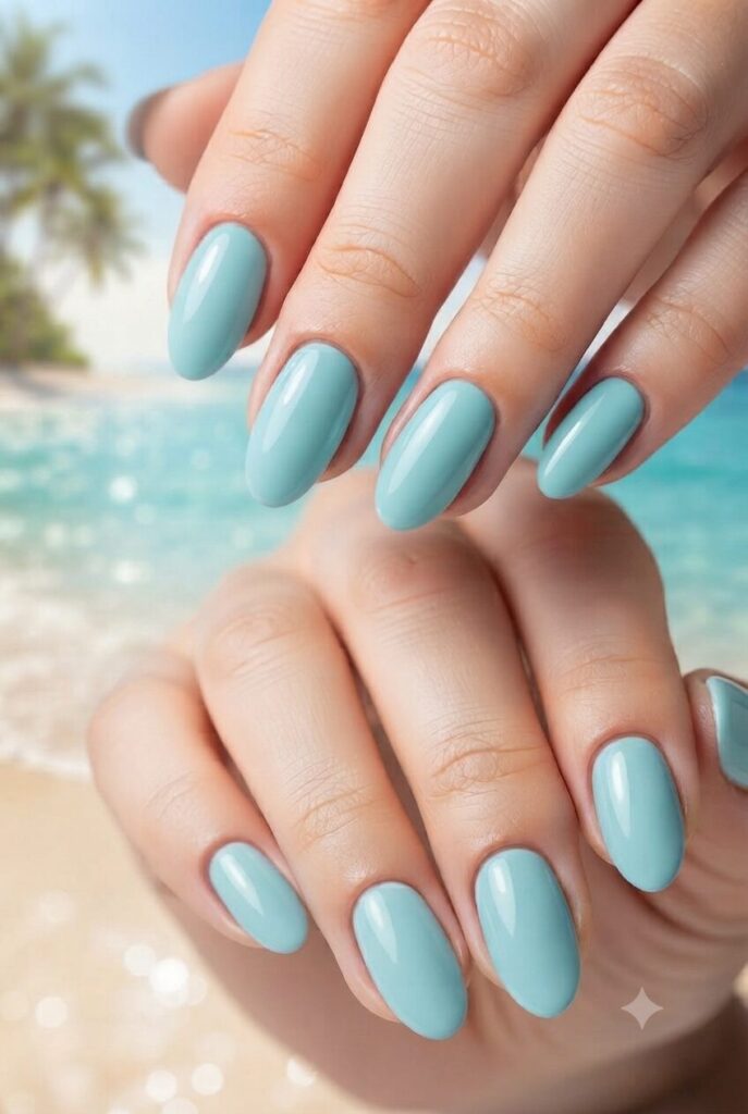 Short almond nails with glossy soft turquoise ocean polish