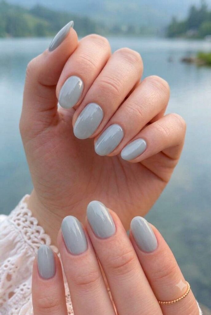 Short almond nails with soft misty gray blue glossy polish