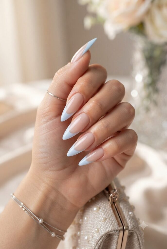Long stiletto nails with soft baby blue French tips