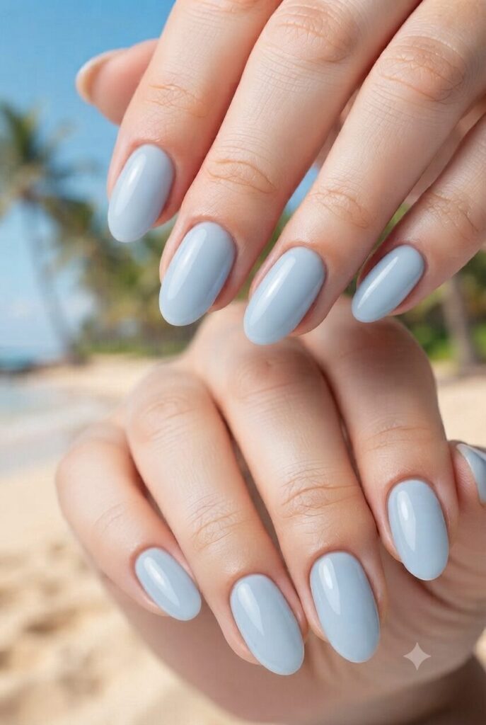 Short oval nails with soft glossy baby blue polish
