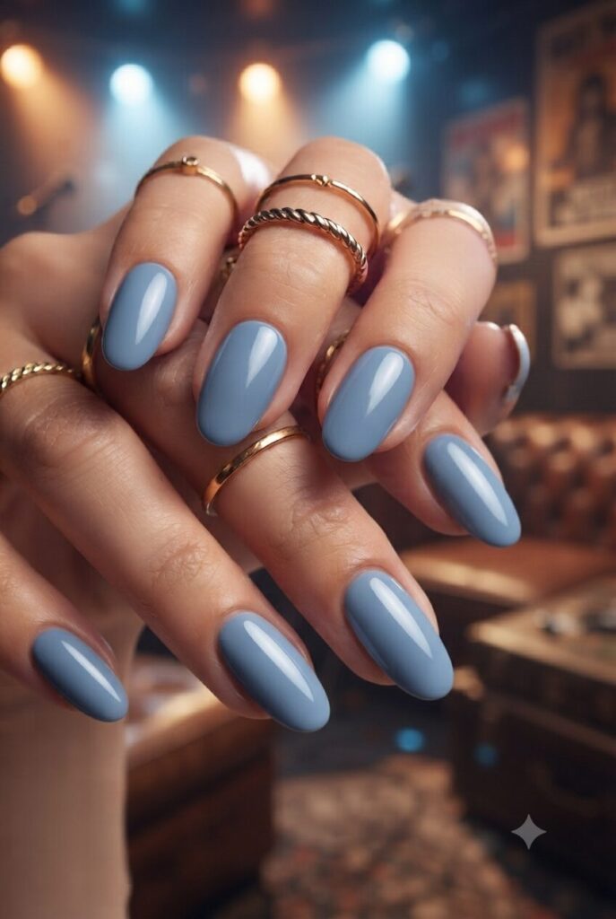 Short almond nails with soft glossy denim blue polish