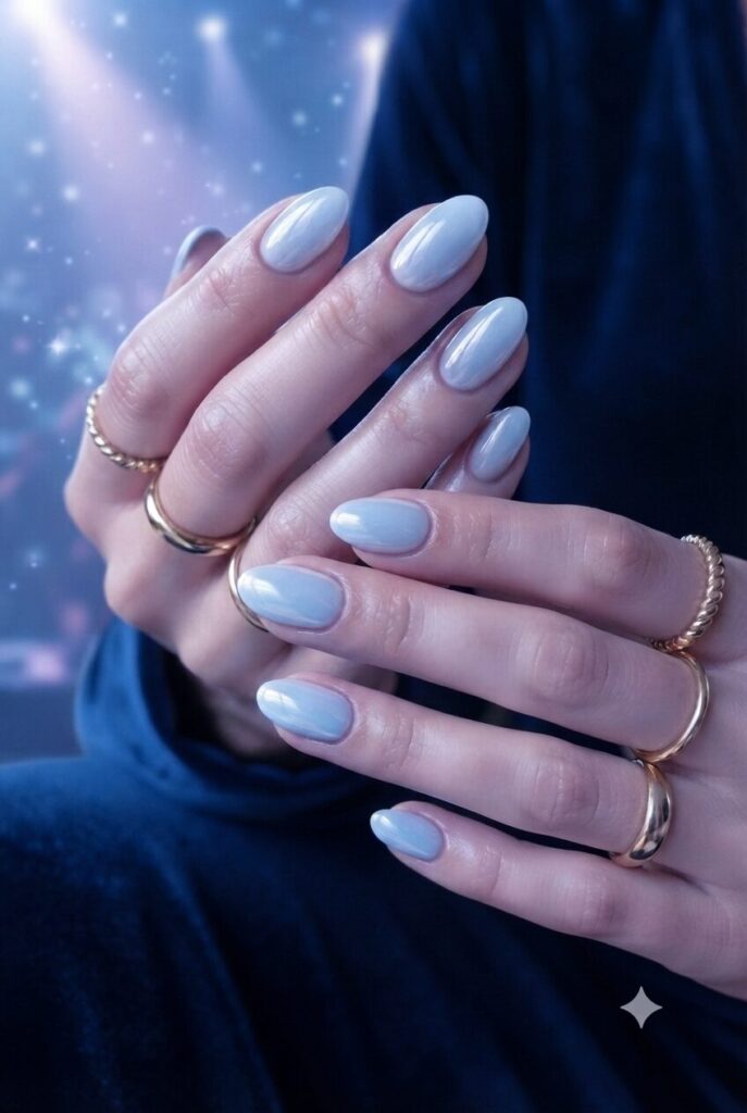 Short oval nails with soft glossy ice blue glazed polish