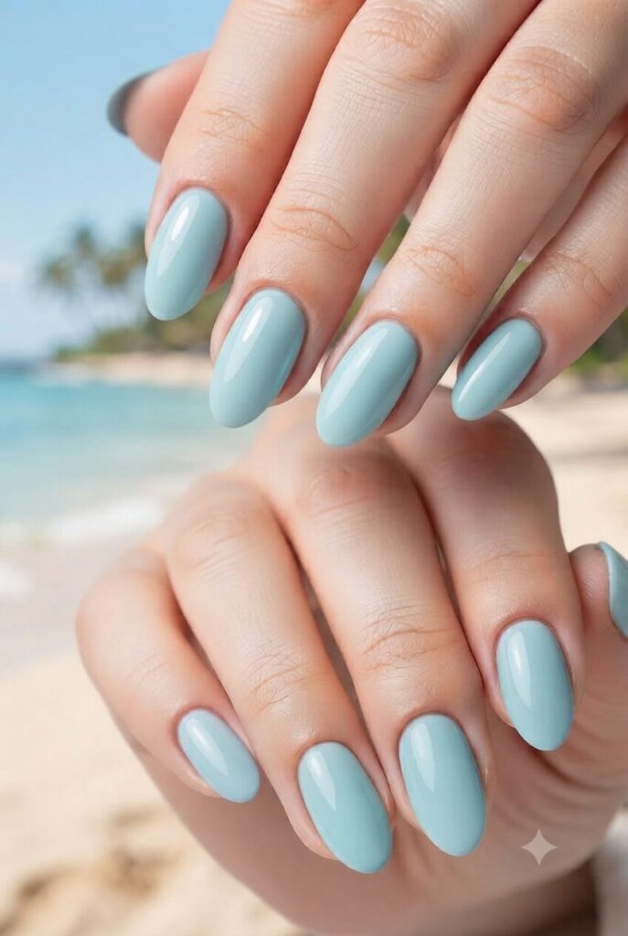 Short oval nails with soft glossy mint ocean blue polish