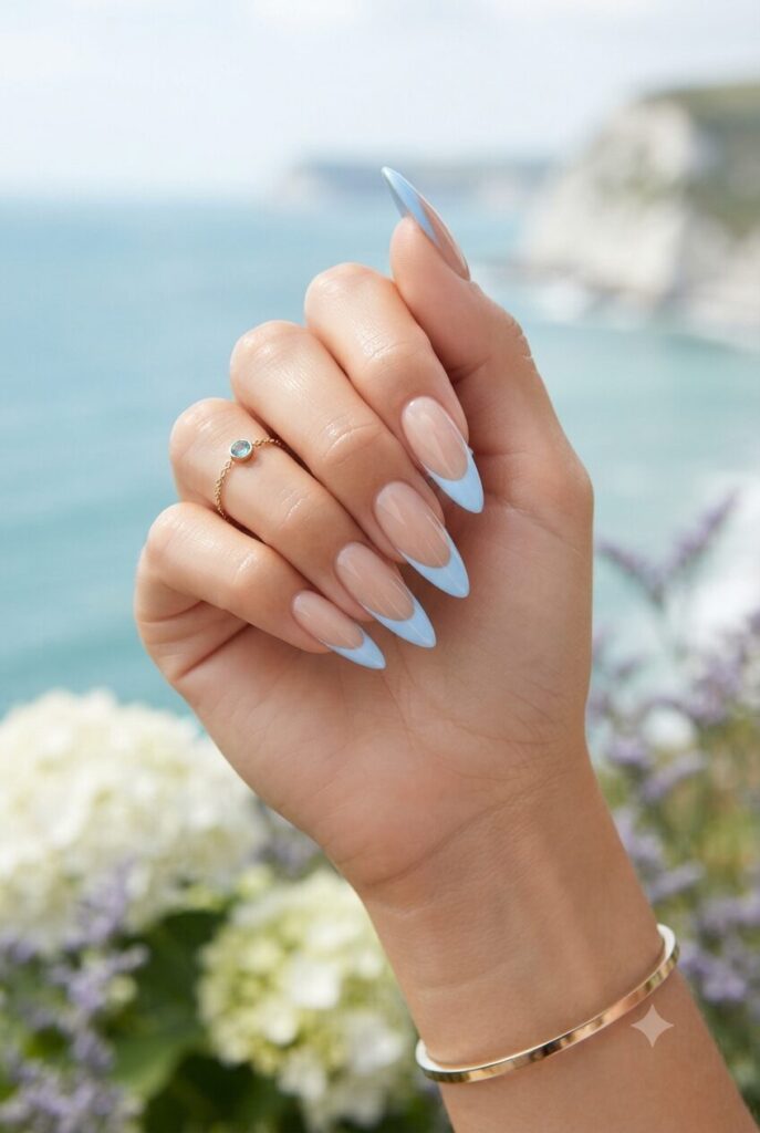 Long stiletto nails with soft sky blue French tips